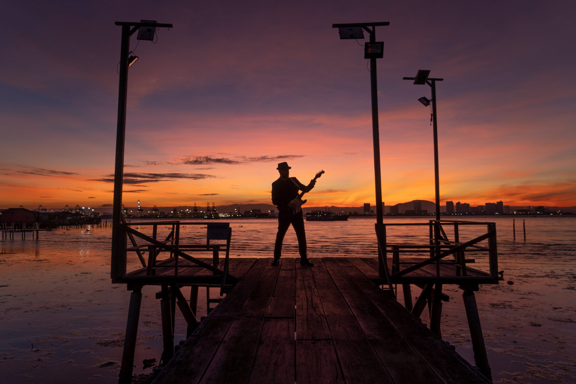 Luis Coelho at a low-tide pier in last light