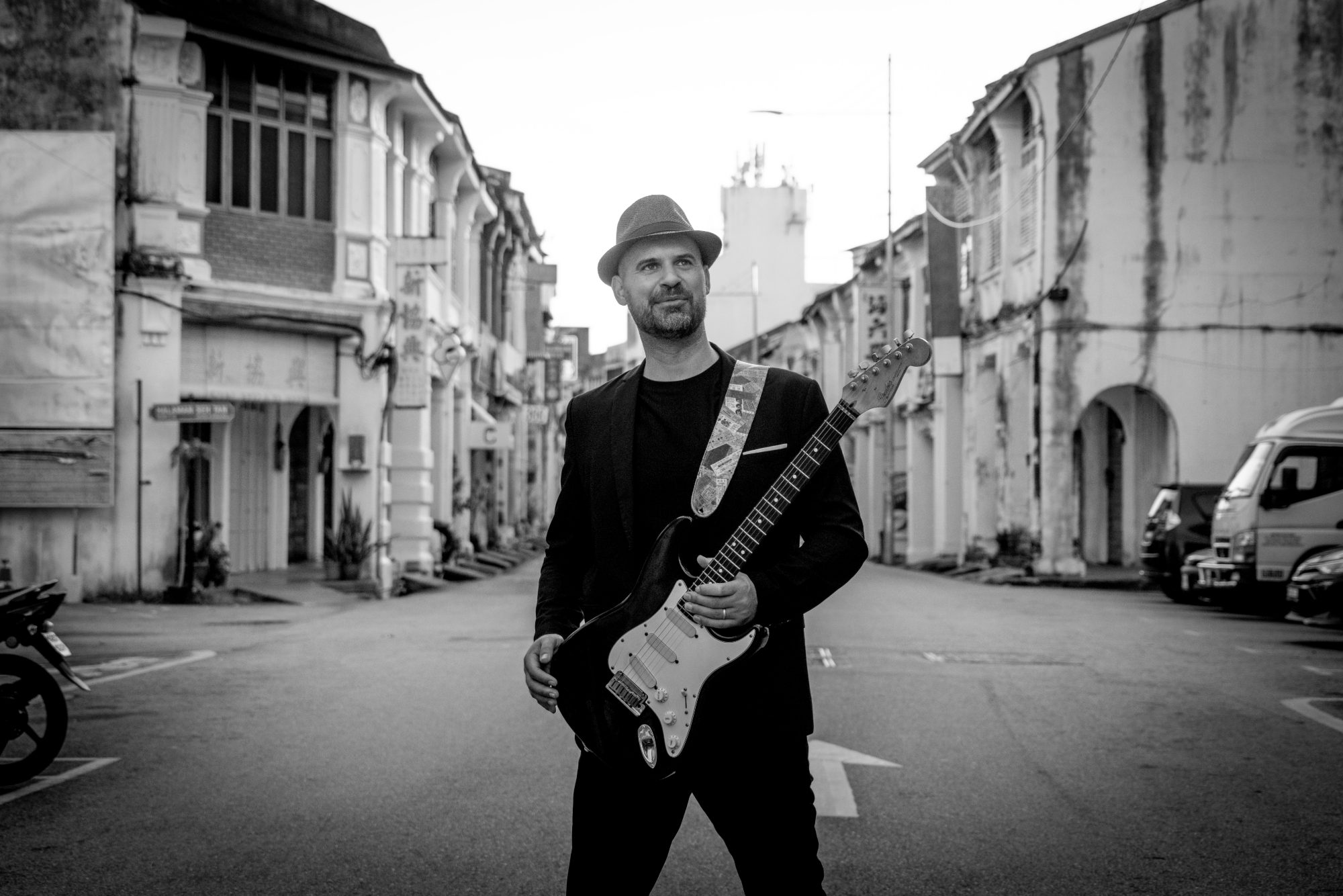 Luis Coelho, Portuguese guitarist, black and white portrait with guitar